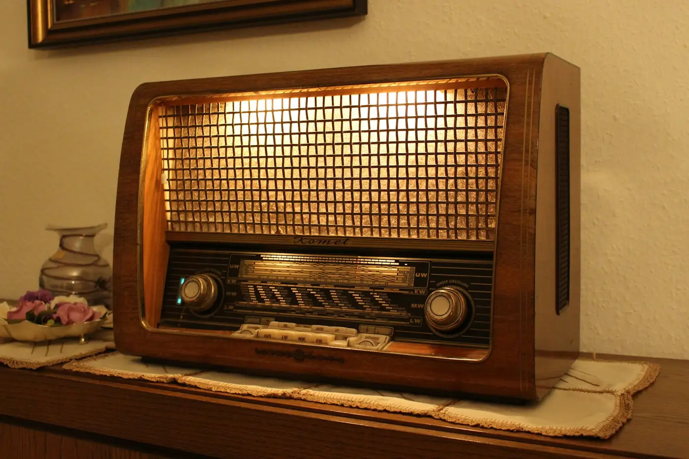 A wooden valve radio on a sideboard