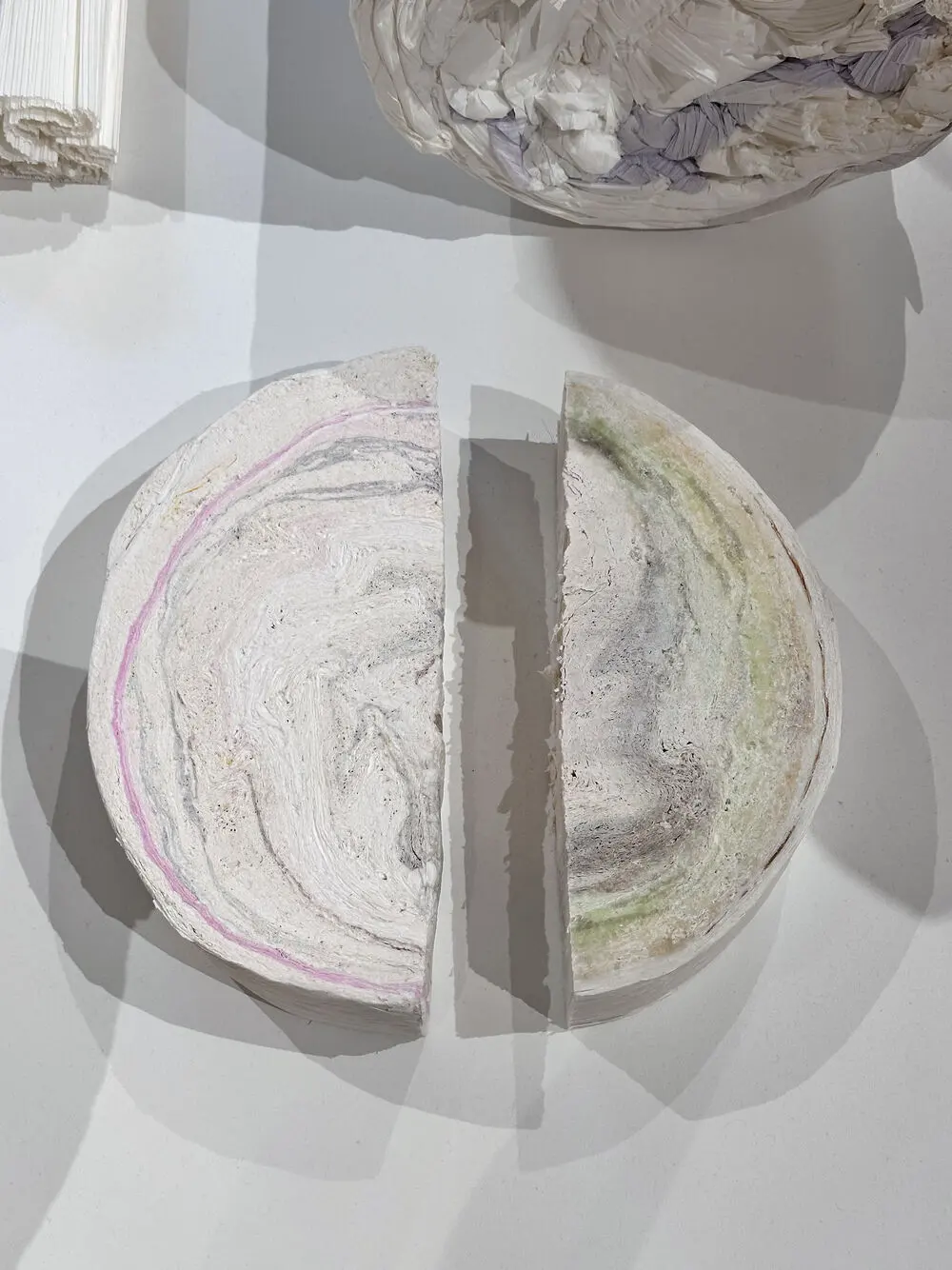 Cross-section of a paper log showing bands like sedimentary rock
