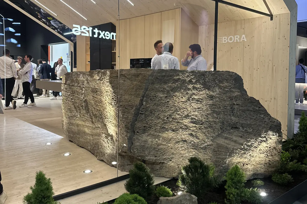 Bora’s stand at Salone del Mobile.Milano 2026, with a kitchen counter anchored in a mass of rock